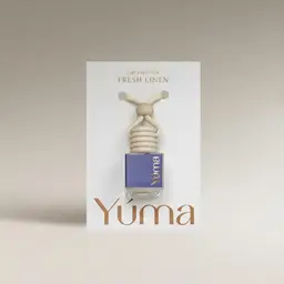 YUMA Fresh Linen Car Diffuser in a glass bottle with a wooden cap and cord.