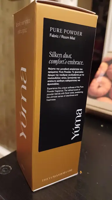Upright YUMA paper packaging in ochre with a black label for Pure Powder.
