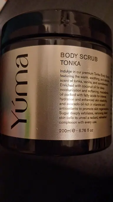 YUMA TONKA Body Scrub black jar with a silver label and black lettering on a dark background.