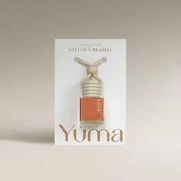 YUMA Salted Caramel Car Diffuser in a glass bottle with a wooden cap and rope.