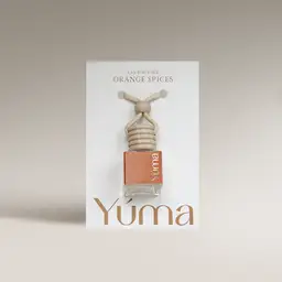 YUMA Orange Spices Car Diffuser in a glass bottle with a wooden cap and cord.