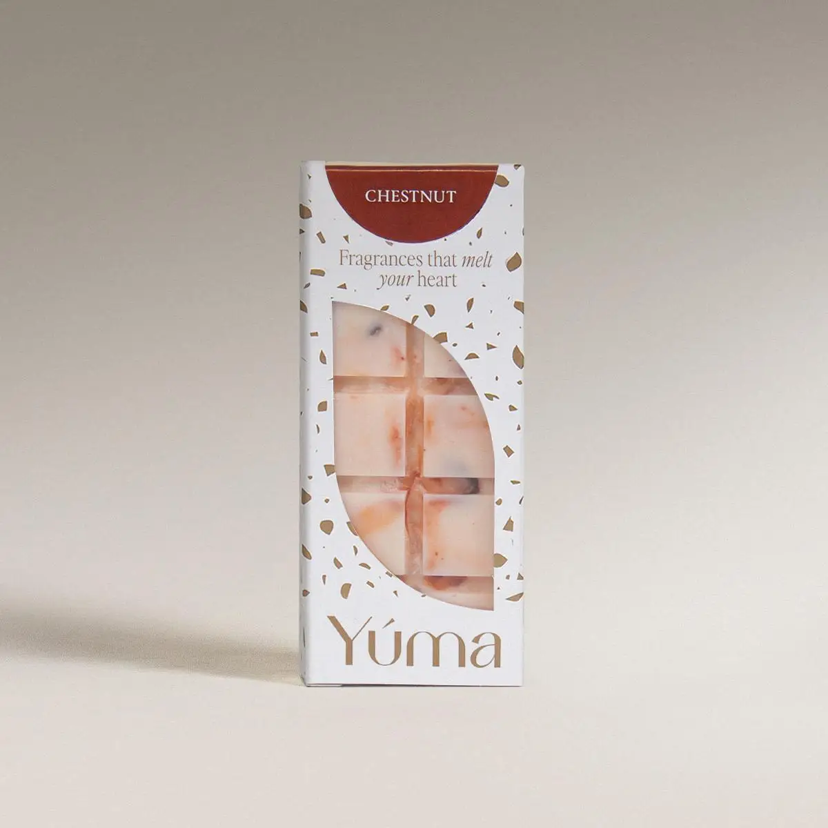YUMA Chestnut wax melts in white packaging with an opening that reveals the embossed wax bar.
