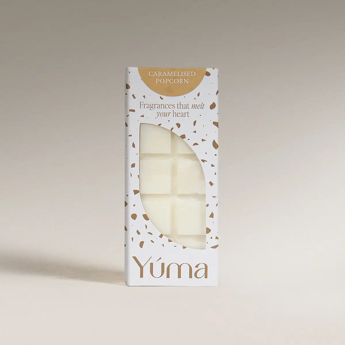 YUMA Caramelized Popcorn Wax Melts in a white box with brown details and wax cubes visible.