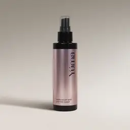 YUMA Cotton Candy Hair & Body Mist in a metallic pink bottle with a black cap.
