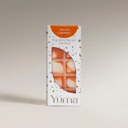 YUMA Salted Caramel wax melts in white packaging with orange detailing, on a neutral background.