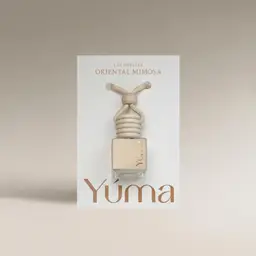 YUMA Oriental Mimosa Car Diffuser in a glass bottle with a wooden cap.