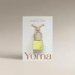 YUMA Eternal Eden Car Diffuser small glass bottle filled with yellow liquid and fitted with a wooden cap.