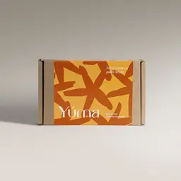 YUMA Gold Orchid paper packaging with orange and yellow abstract designs.