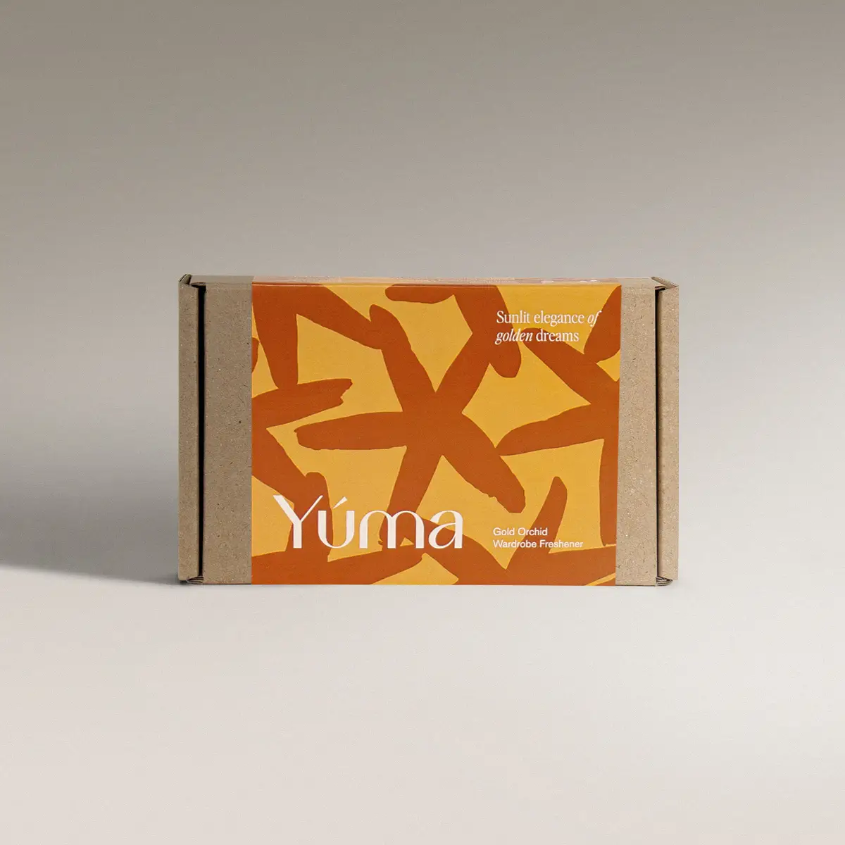 YUMA Gold Orchid paper packaging with orange and yellow abstract designs.