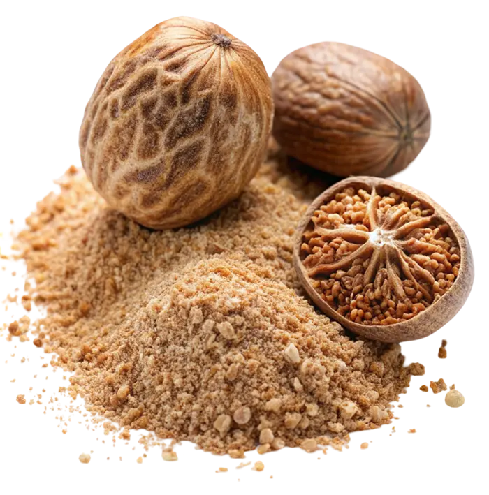 Whole nutmegs and one halved nutmeg beside a small mound of ground brown spice.
