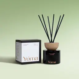 YUMA Hesperides Jasmine reed diffuser in a black glass vessel beside its packaging.