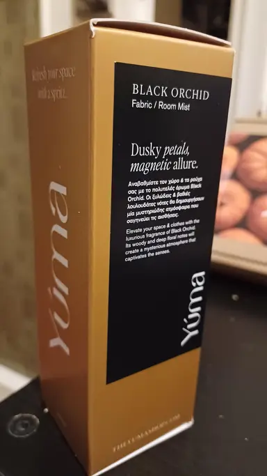 Gold YUMA Black Orchid Fabric Room Mist packaging with a black label and white text.