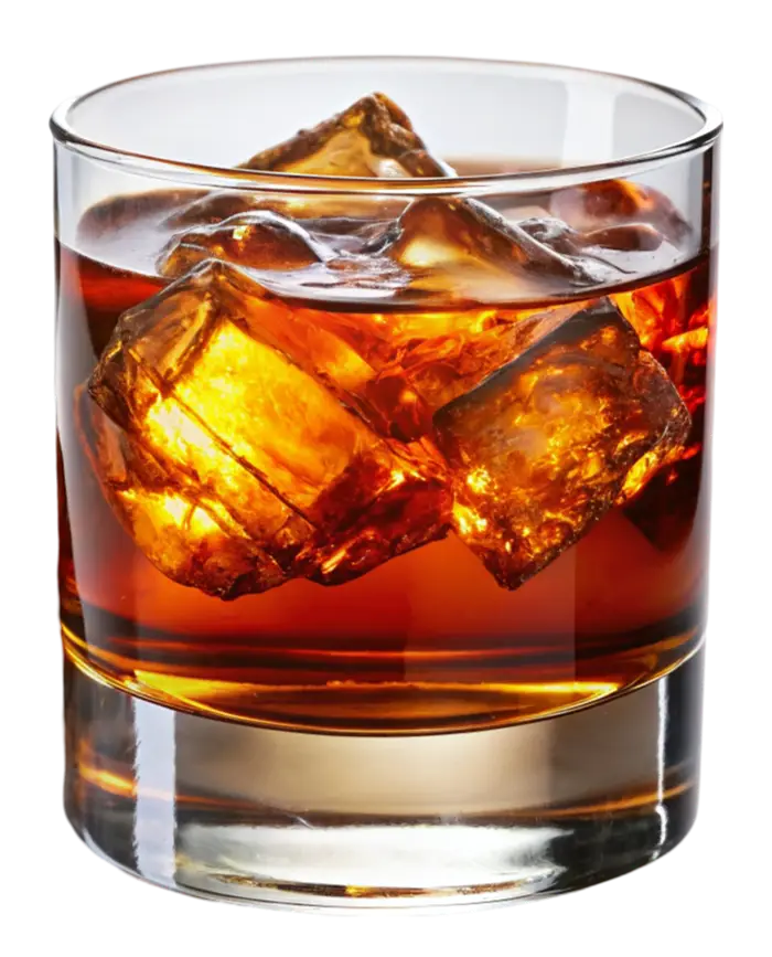 A short glass filled with amber liquid and ice cubes, on a white background.