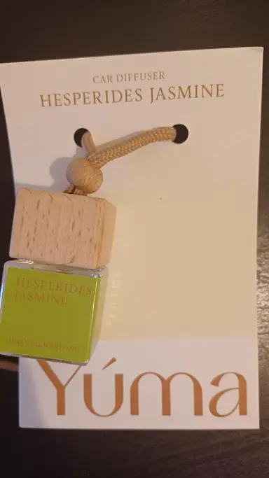 YUMA Hesperides Jasmine Car Diffuser with a wooden cap and cord, in white packaging.