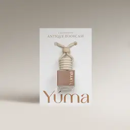 YUMA Antique Bookcase Car Diffuser in a glass bottle with a wooden cap and beige rope, shown in white packaging.