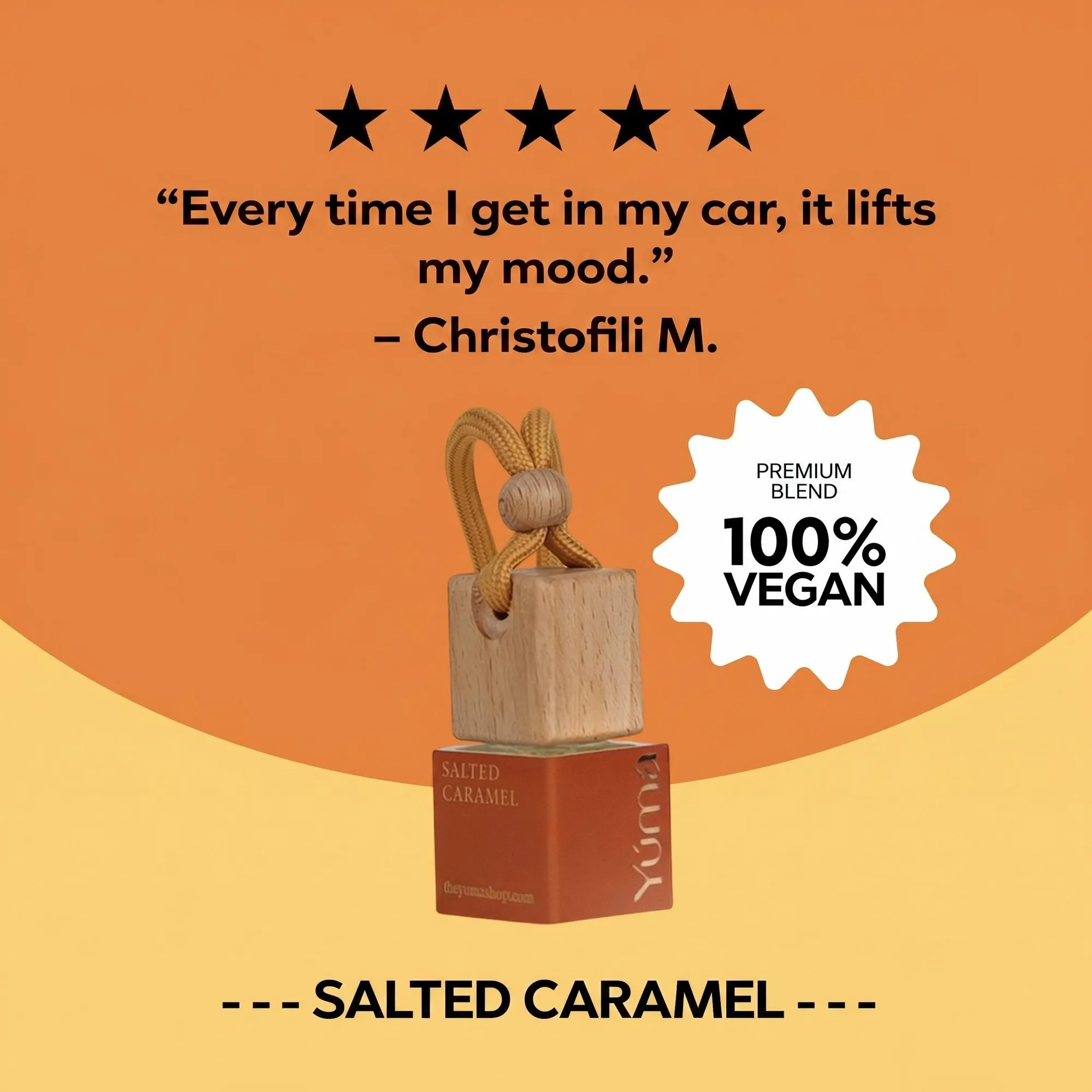 YUMA Salted Caramel Car Diffuser with a wooden cap and cord on an orange background.