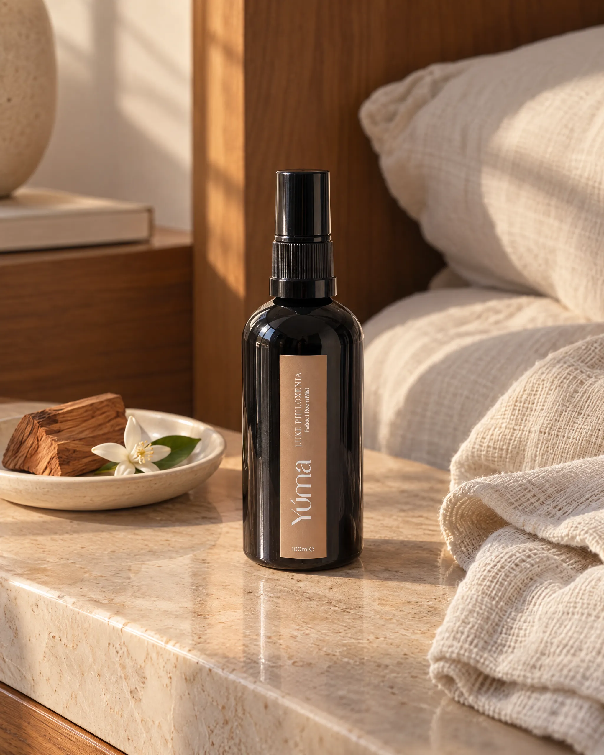 Yúma Luxe Philoxenia Fabric/Room Mist in a home setting.