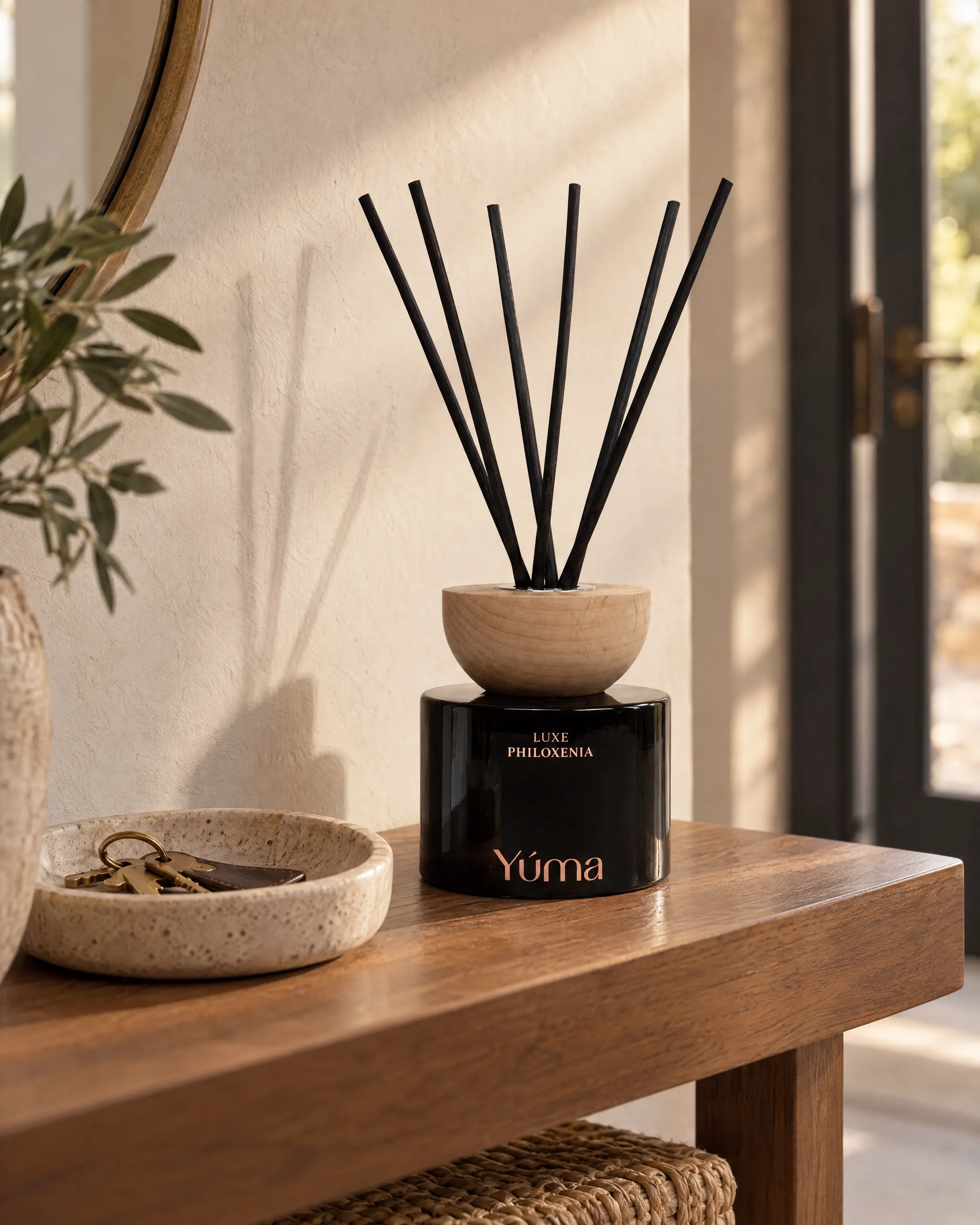 Yúma Luxe Philoxenia Reed Diffuser in a home setting.
