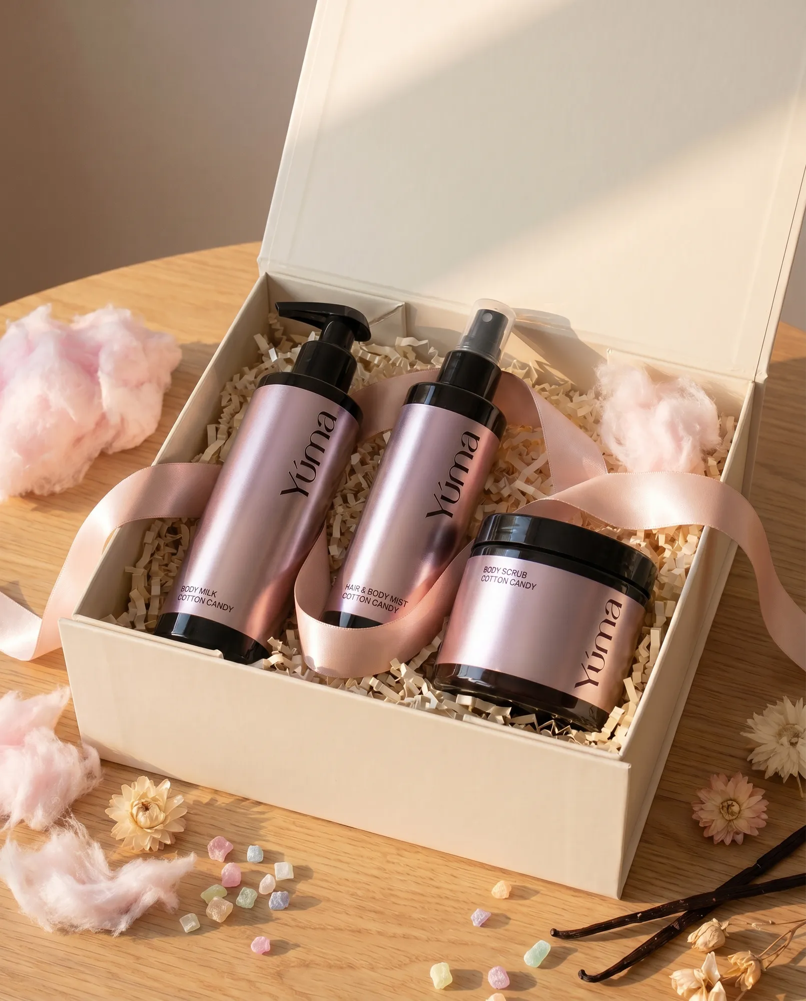 YUMA Cotton Candy Gift Set with products in pink metallic packaging, presented in a luxury gift box.