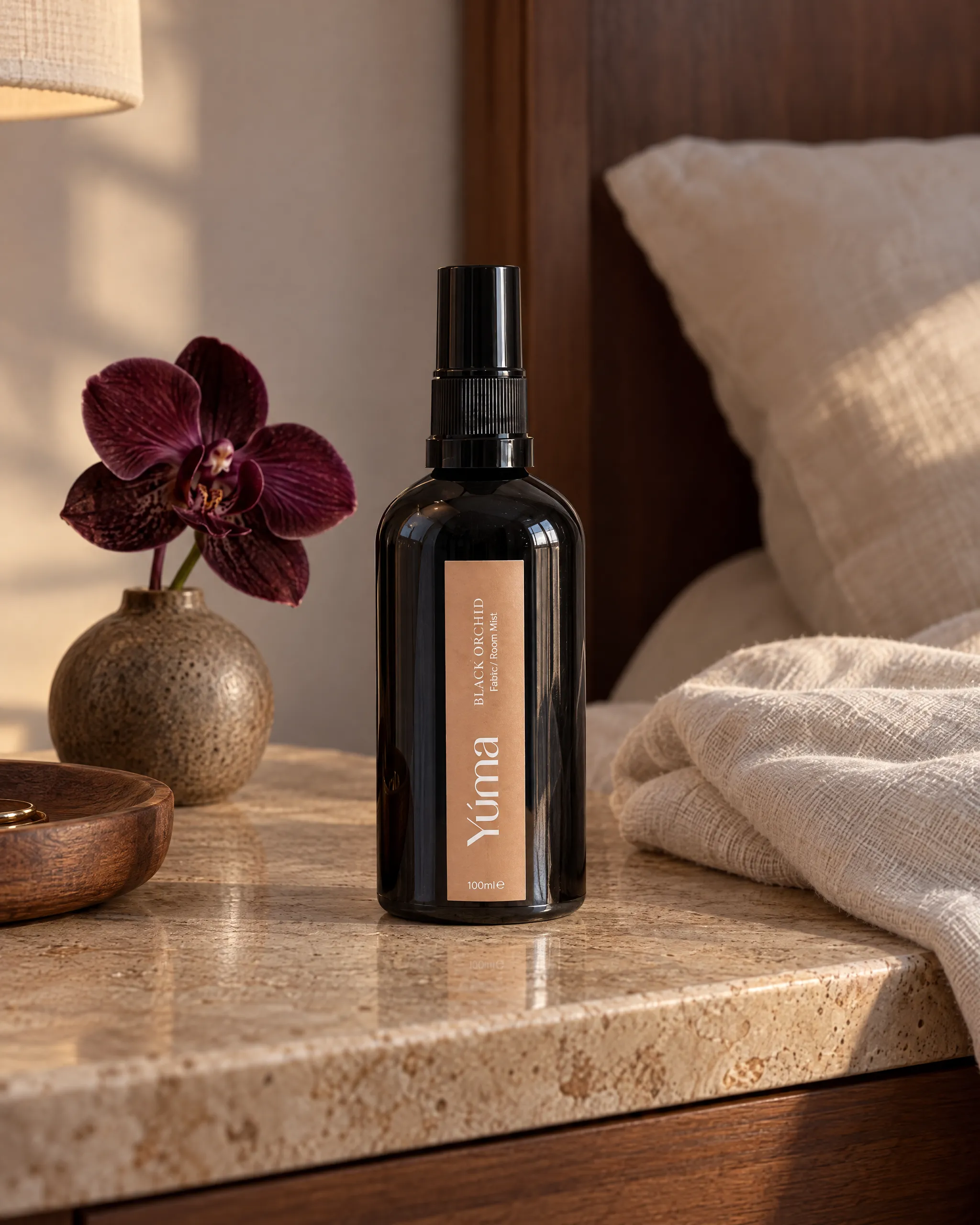Yúma Black Orchid Fabric/Room Mist in a home setting.