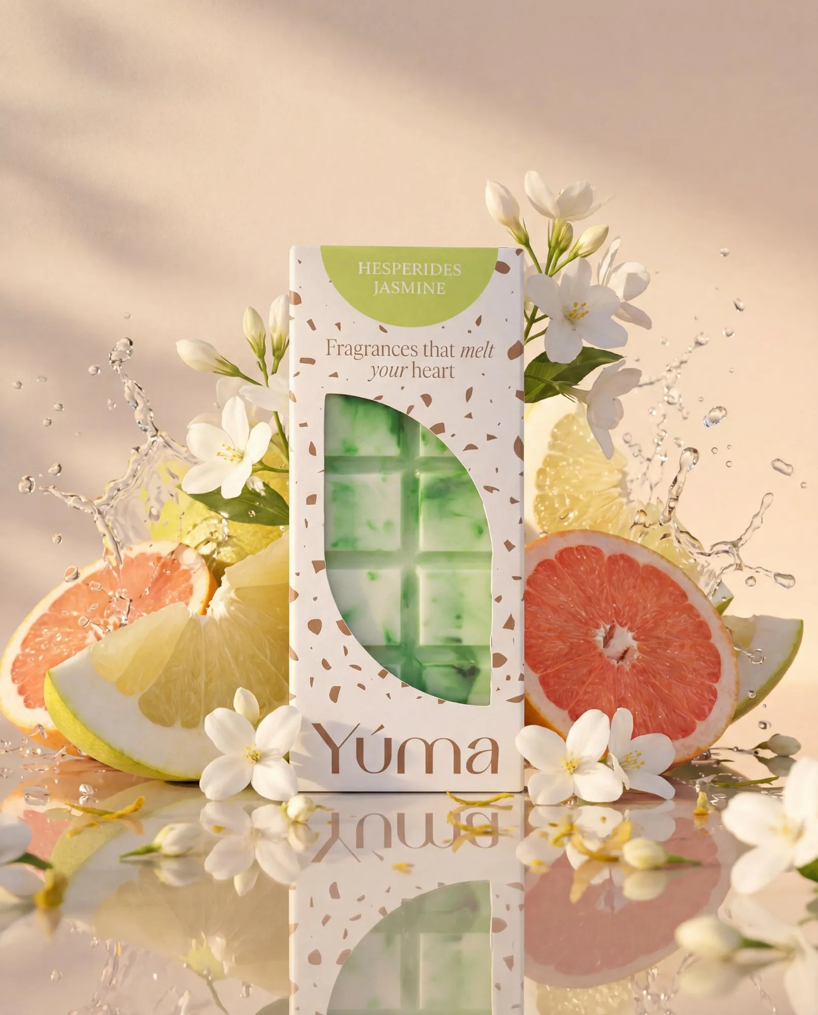 YUMA Hesperides Jasmine wax melts packaging surrounded by citrus slices, white flowers, and water splashes.
