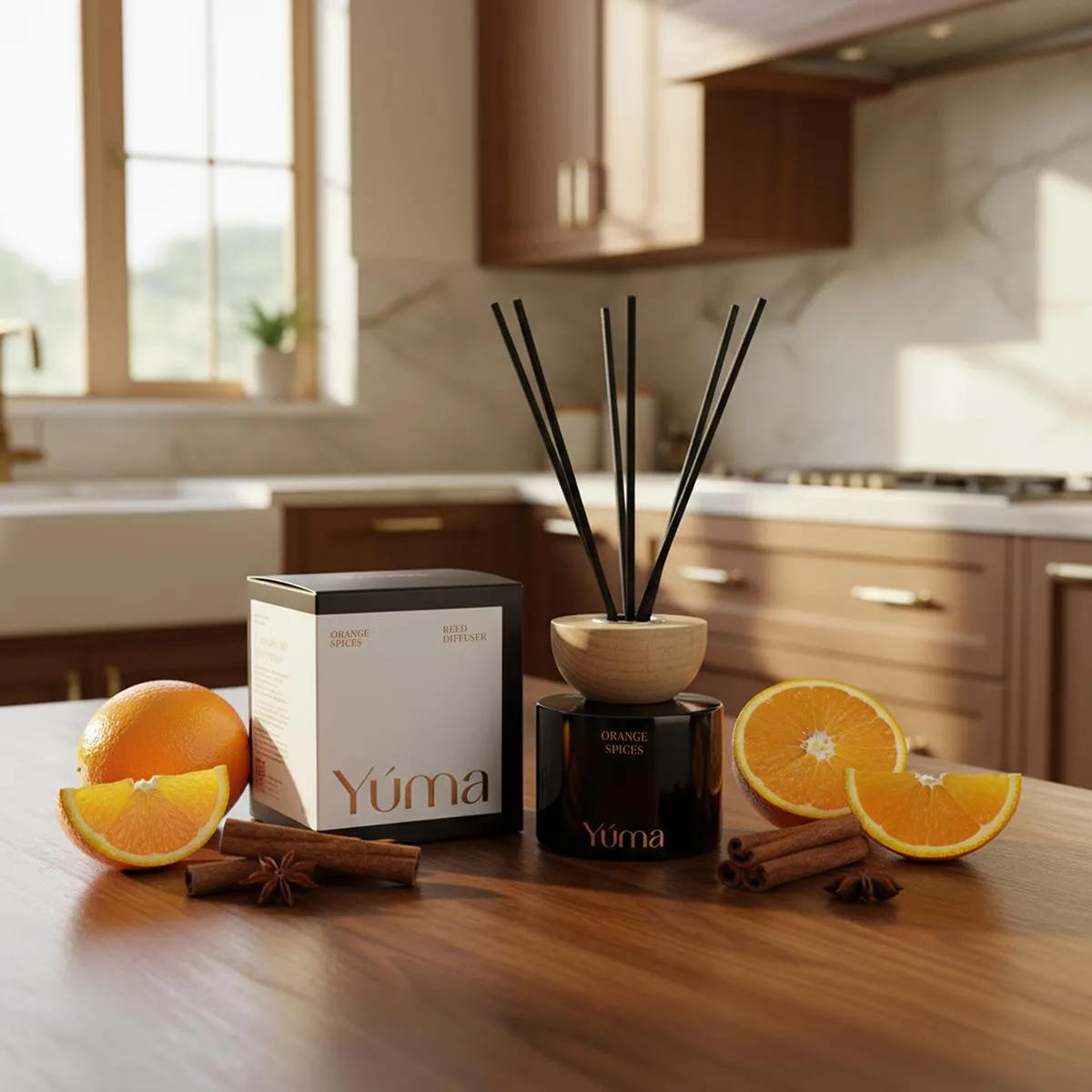 YUMA Orange Spices reed diffuser with cinnamon sticks and orange slices on a wooden kitchen counter.