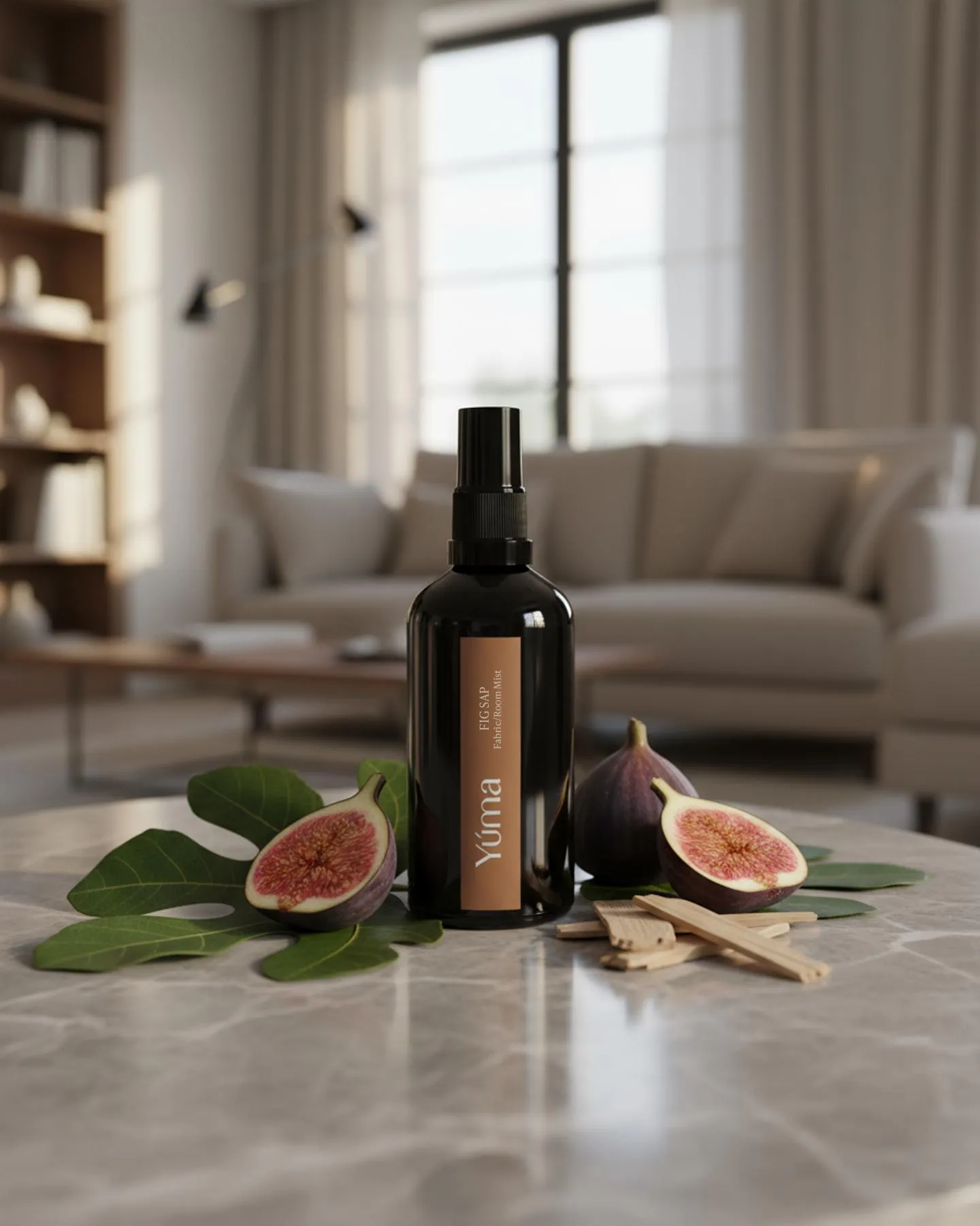 YUMA Fig Sap Fabric Mist black bottle surrounded by fresh figs and leaves.