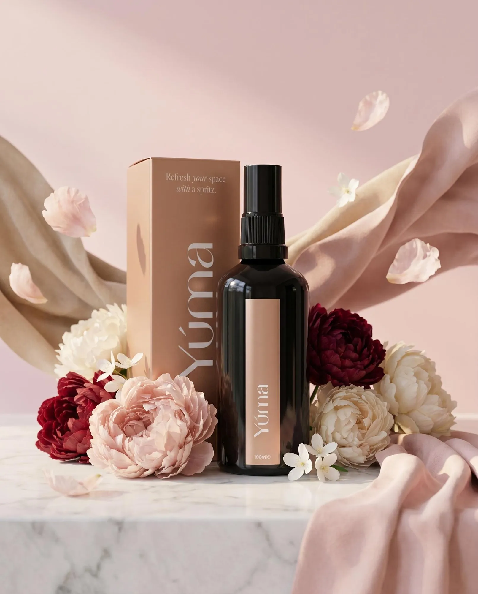 YUMA Peony Velvet room spray in a black bottle, nestled among peonies and soft fabrics.
