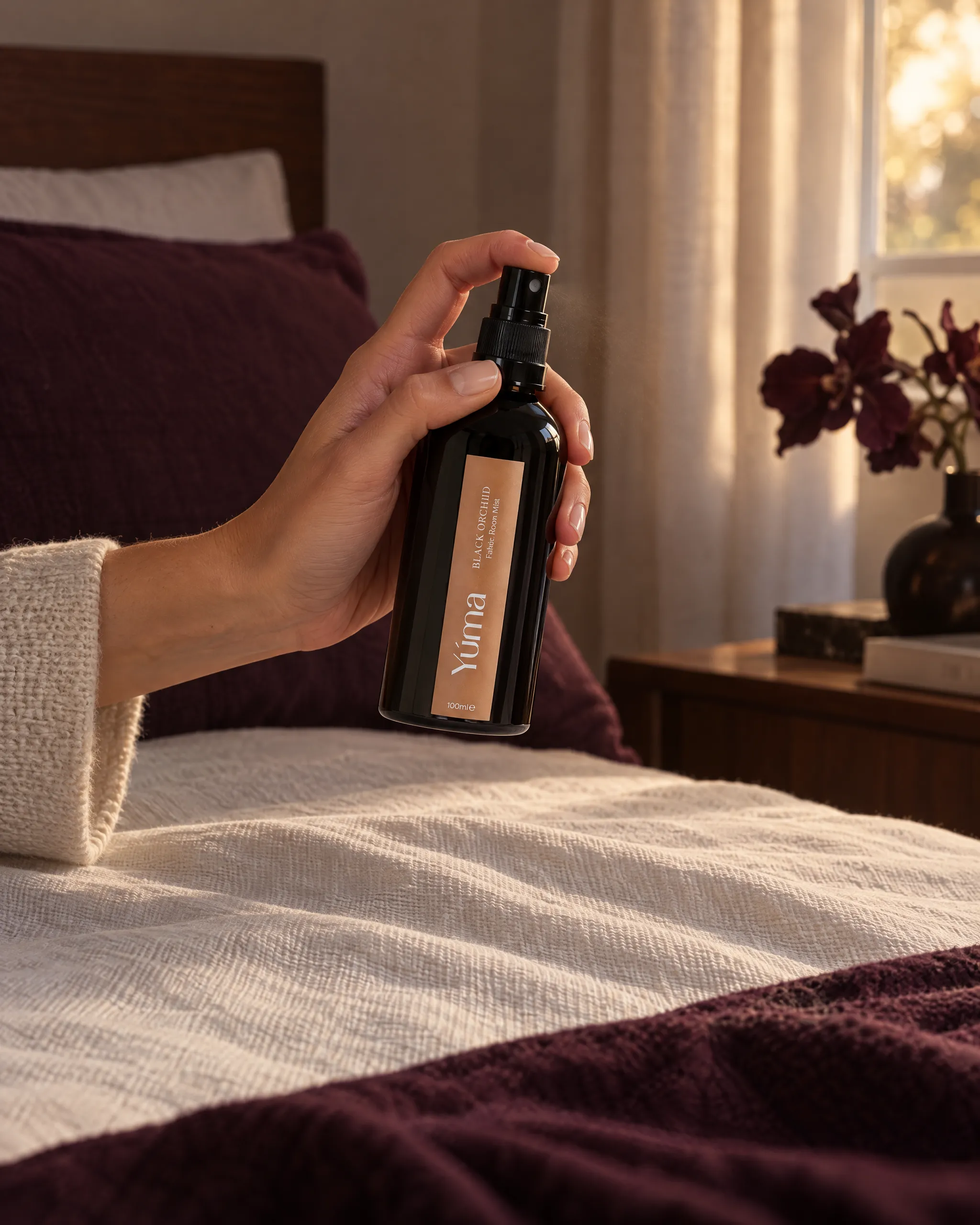 Yúma Black Orchid Fabric/Room Mist in a home setting.