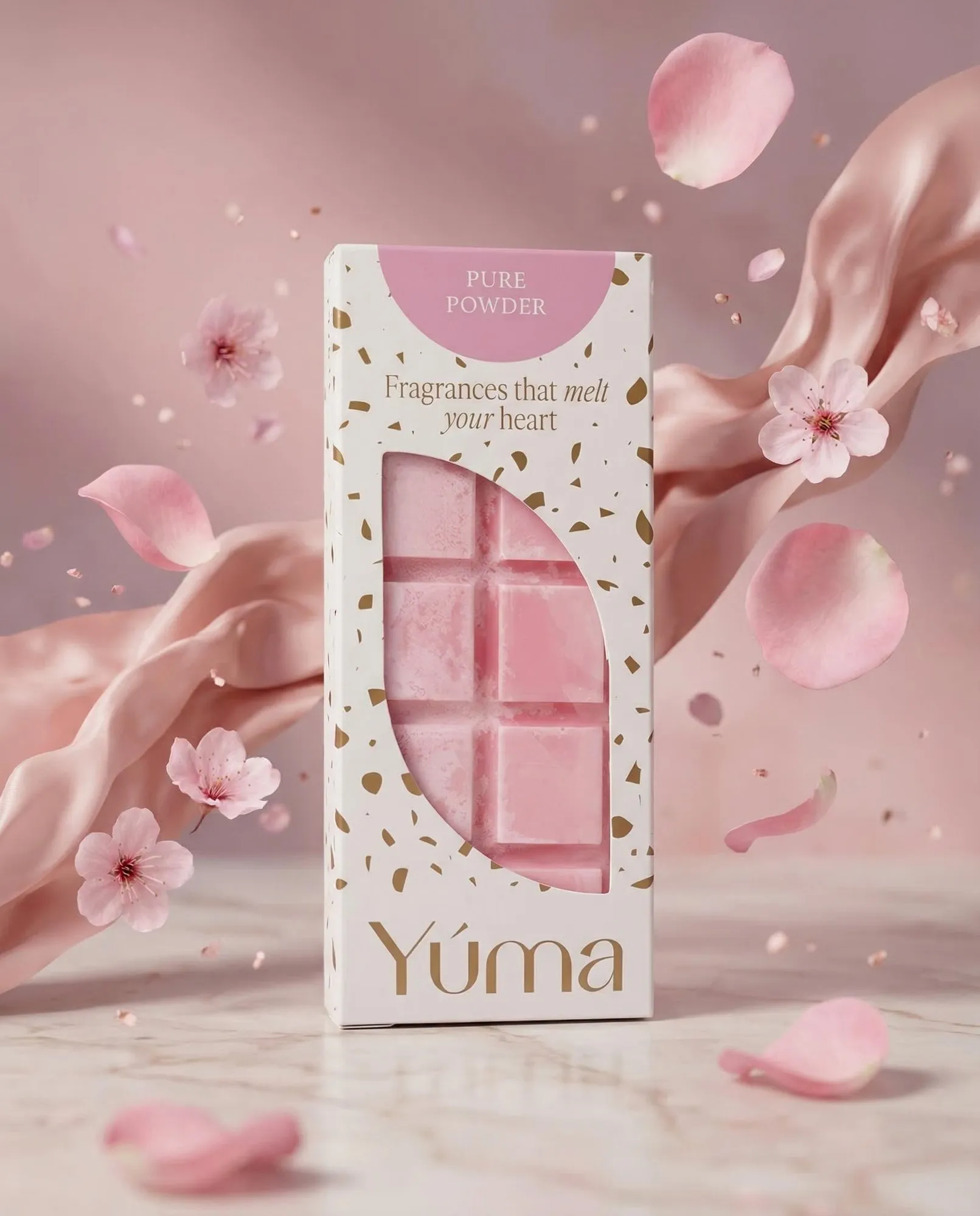 YUMA Pure Powder pink wax melts in white packaging surrounded by petals and cherry blossoms.