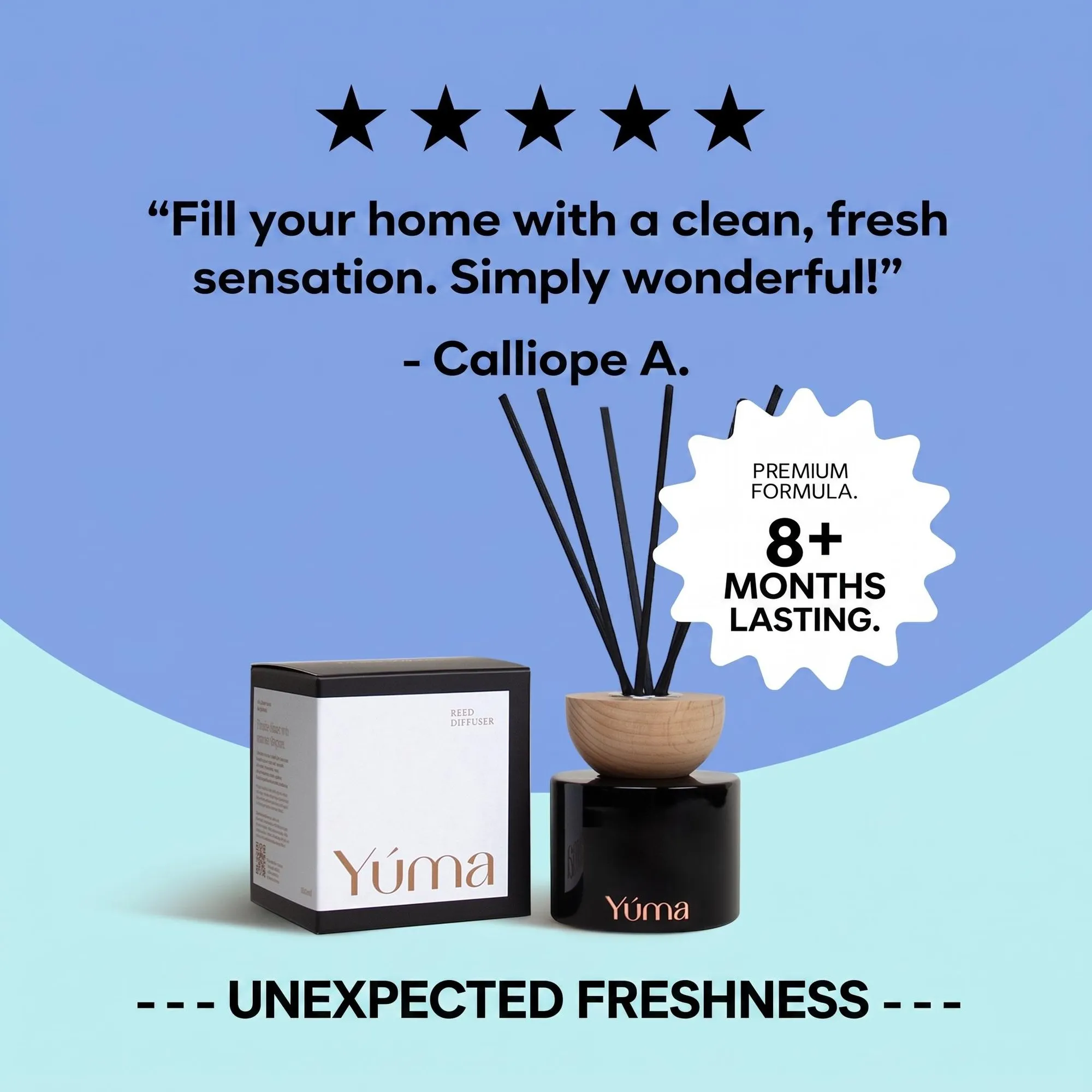YUMA black glass reed diffuser with a wooden cap and black reeds next to its packaging.