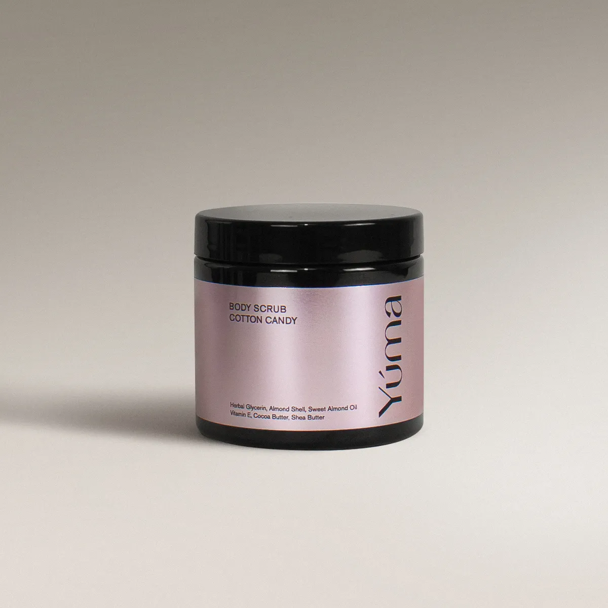 YUMA Cotton Candy Body Scrub in a black jar with a pink metallic label on a grey background.