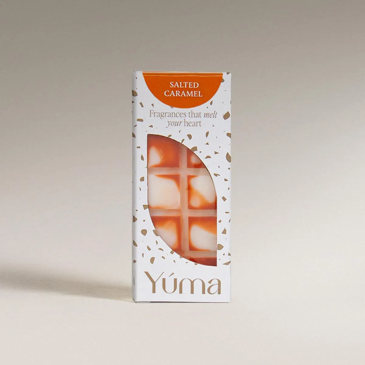 Salted Caramel Snap Bar YUMA Salted Caramel wax melts in white packaging with orange detailing, on a neutral background.