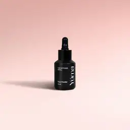 Car Diffuser Refill Pure Powder YUMA Car Diffuser Refill black glass bottle in Pure Powder scent on a pink background.